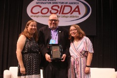 Lenny Reich with his wife Helen and daughter Caroline in 2019, where he received the Warren Berg Award.